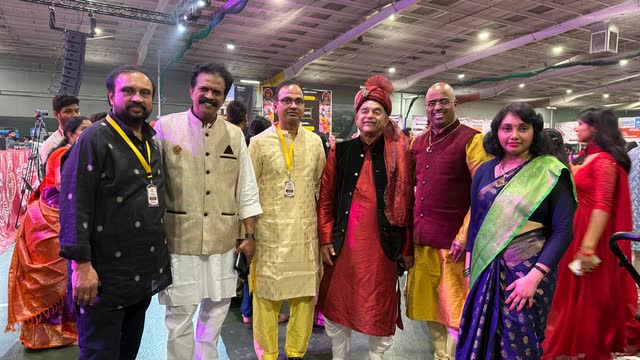 Rakesh Raizada with friends in traditional dress at a cultural festival